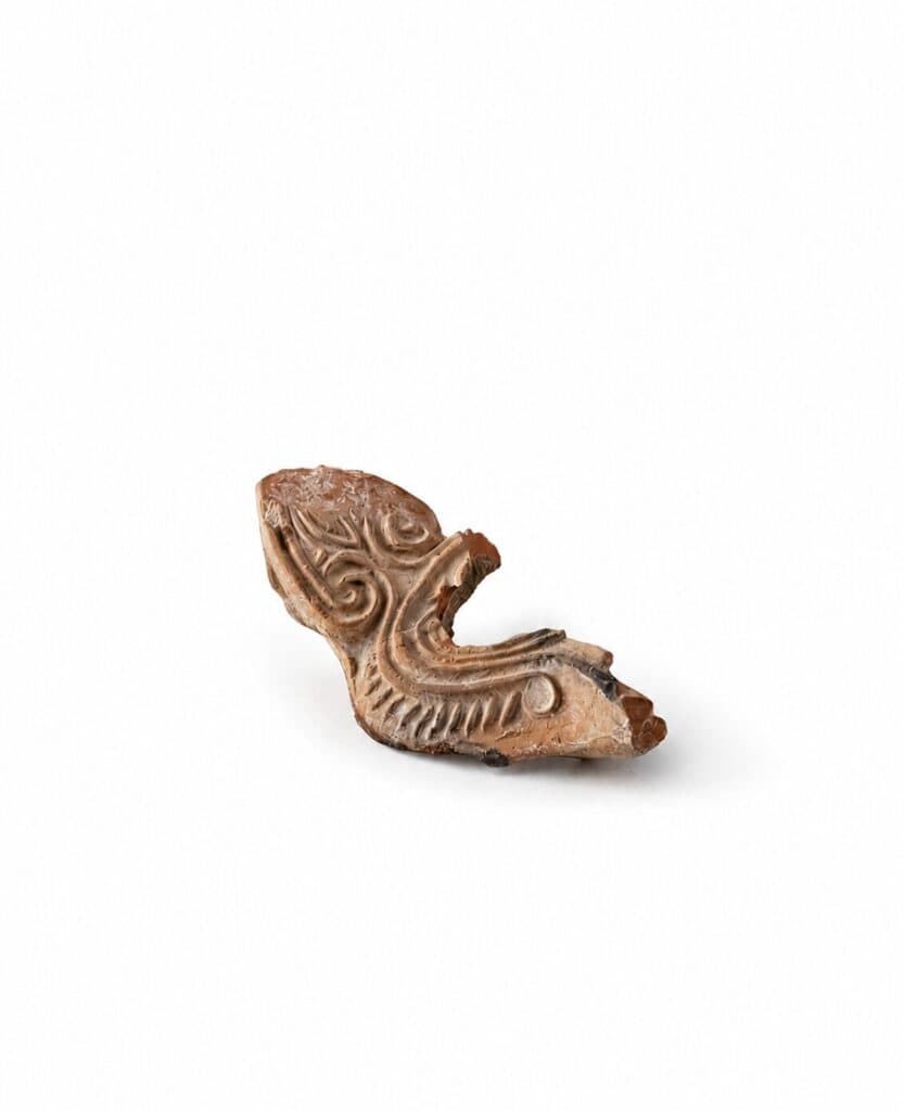 Oil lamp fragment with relief